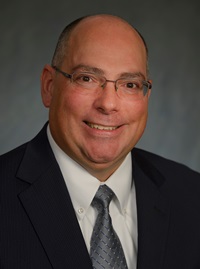 Robert J. Russell, acting CEO